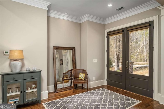 entrance foyer featuring french doors, plenty of natural light, and dark hardwood / wood-style floors