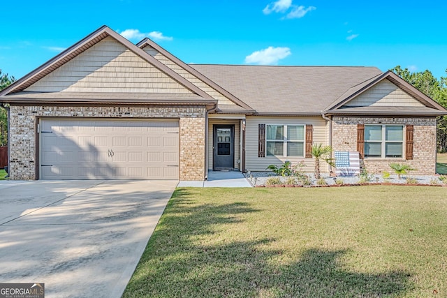 view of front of home with a garage and a front yard