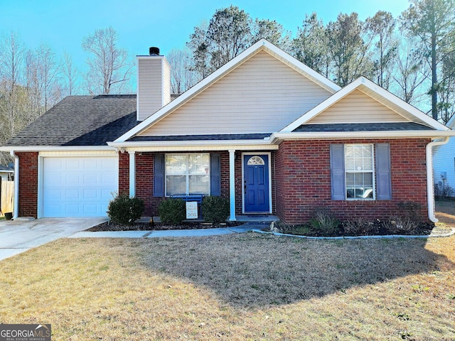 view of front of property with a garage and a front yard