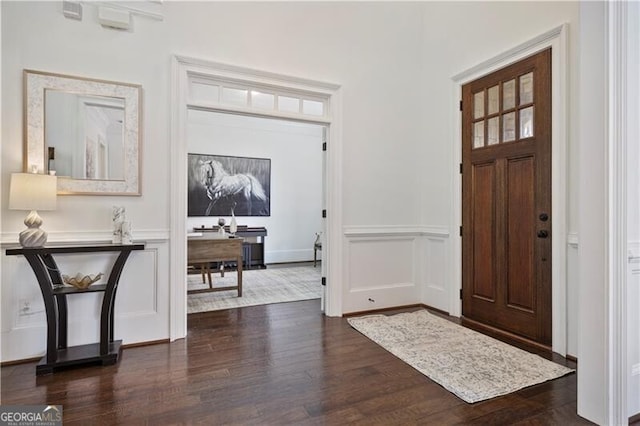 foyer with dark hardwood / wood-style flooring