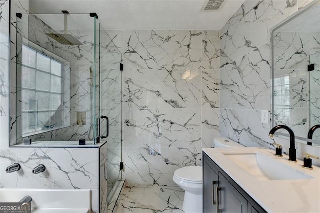 bathroom featuring vanity, tile walls, an enclosed shower, and toilet