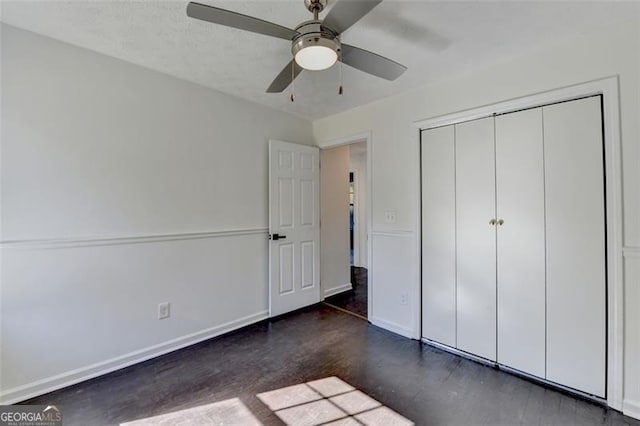 unfurnished bedroom featuring ceiling fan, a closet, and a textured ceiling