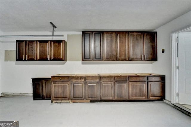 bar featuring dark brown cabinets