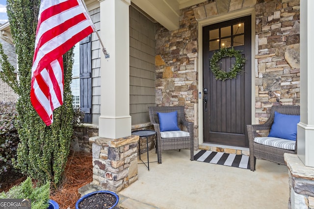 view of exterior entry with covered porch