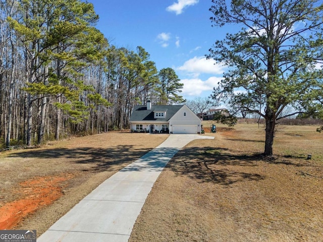 view of front facade with a garage and a front lawn