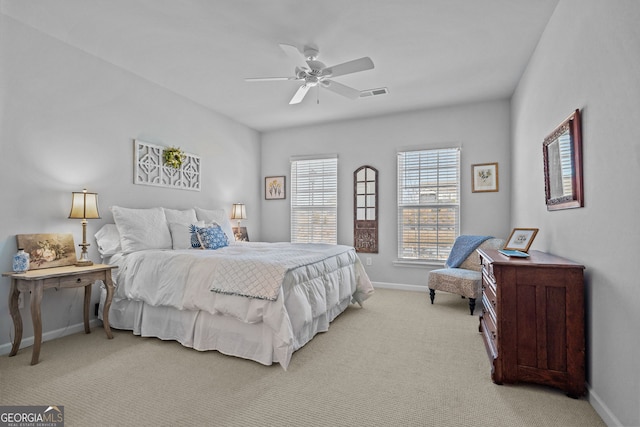 bedroom with light colored carpet and ceiling fan