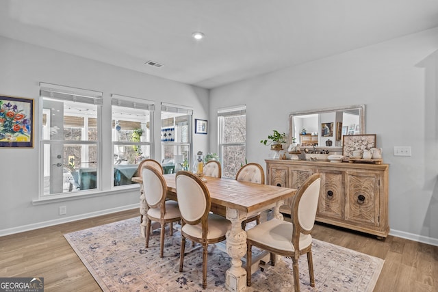 dining area with light wood-type flooring