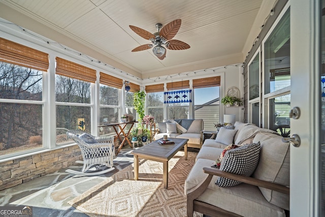 sunroom with wood ceiling and ceiling fan