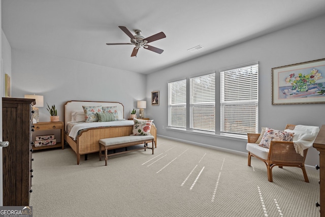 carpeted bedroom with ceiling fan