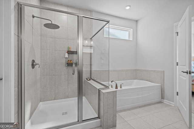 bathroom featuring tile patterned floors and plus walk in shower