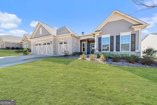 view of front facade featuring a garage and a front yard