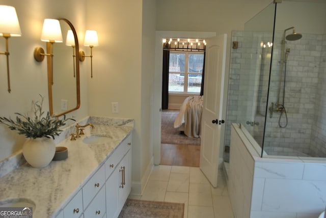 bathroom featuring a shower with door, vanity, and a chandelier