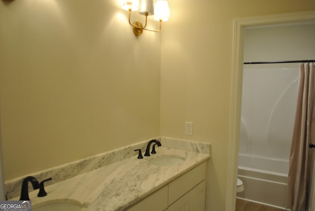 full bathroom featuring vanity, toilet, and shower / bath combo with shower curtain