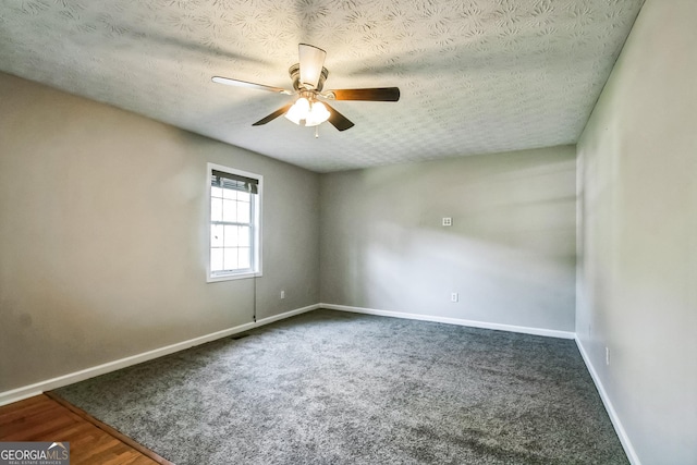 spare room with ceiling fan and a textured ceiling