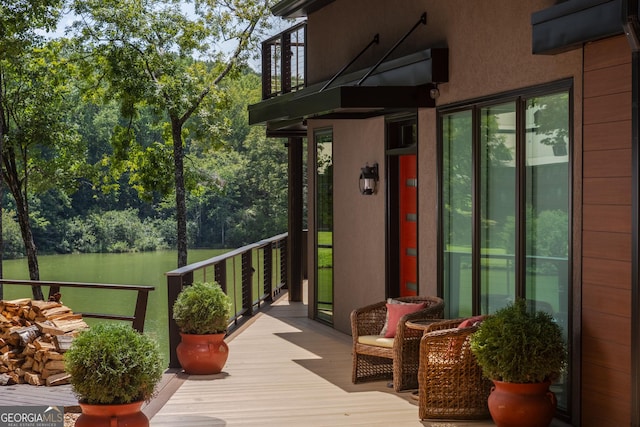 wooden terrace with a water view