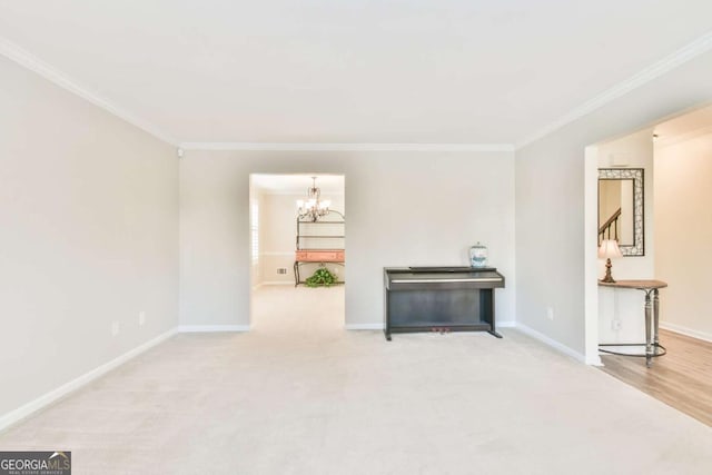 misc room with light carpet, ornamental molding, and a chandelier