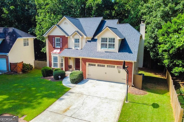 view of front of home featuring a garage and a front yard