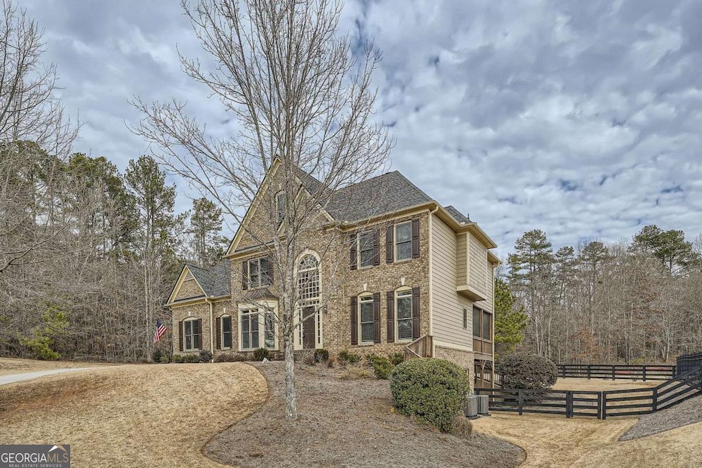 view of front of house with central AC unit