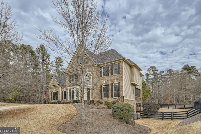 view of front of house with central AC unit