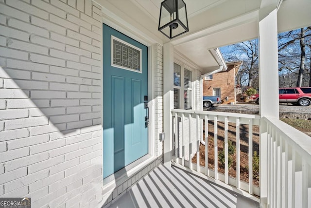 property entrance featuring covered porch