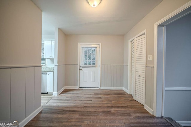 hall with dark wood-type flooring