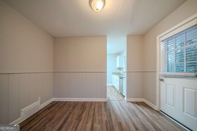 spare room with hardwood / wood-style flooring