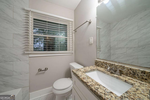 bathroom with vanity and toilet