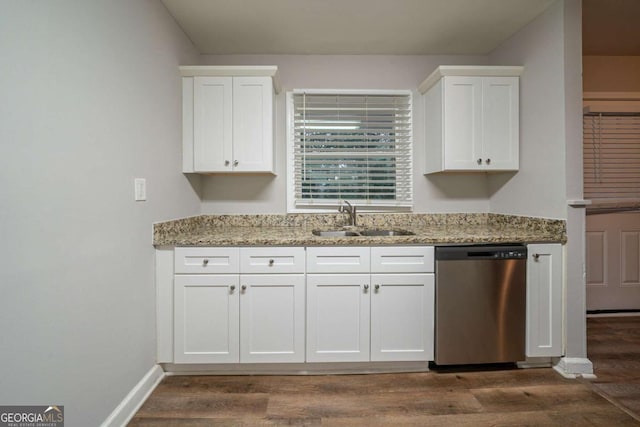 kitchen featuring dishwasher, light stone countertops, sink, and white cabinets