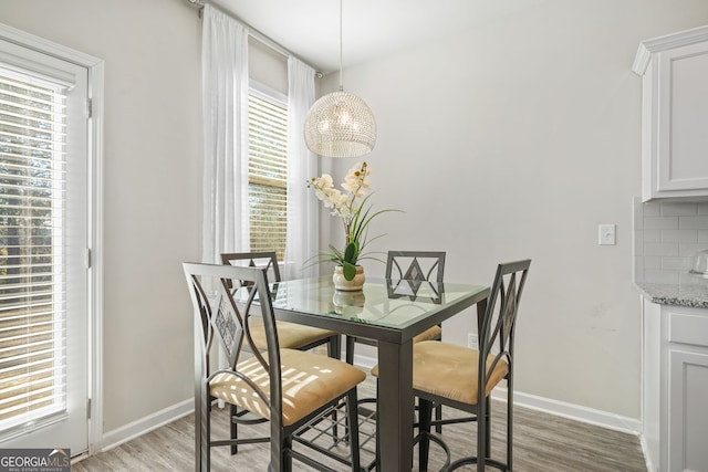 dining space featuring light hardwood / wood-style flooring