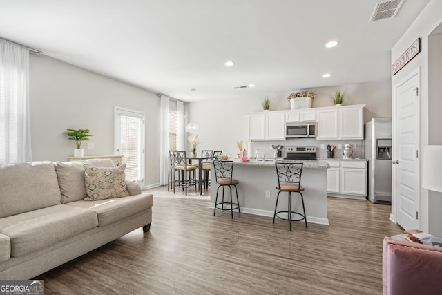 living room featuring dark hardwood / wood-style flooring