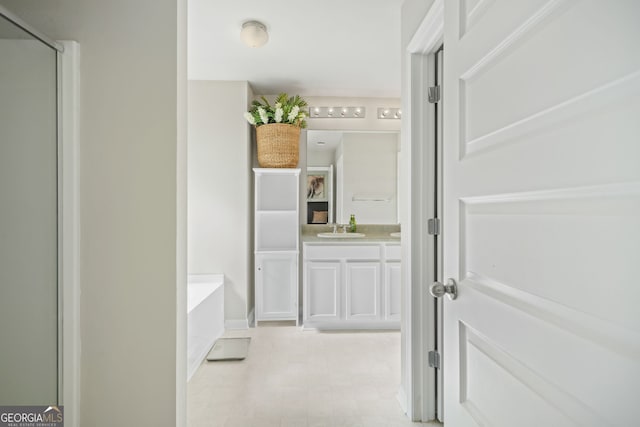 bathroom with vanity and a bathtub