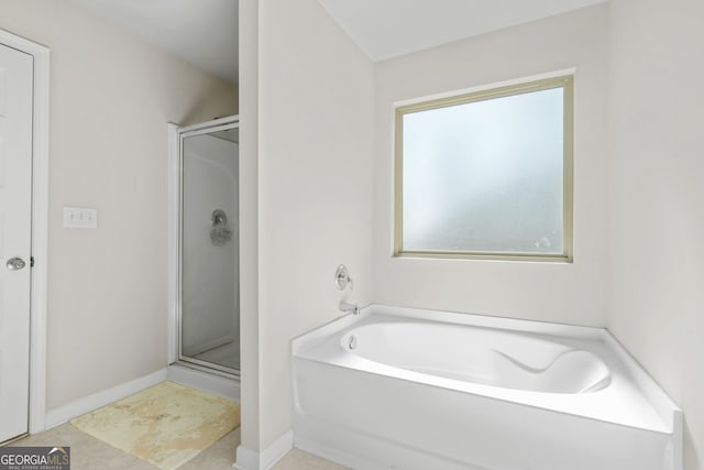 bathroom with separate shower and tub