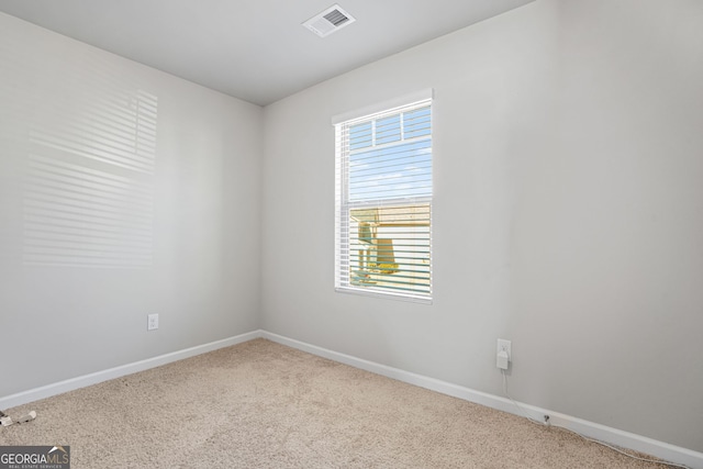 empty room featuring light colored carpet