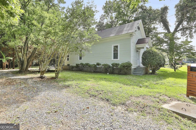 view of home's exterior featuring a yard