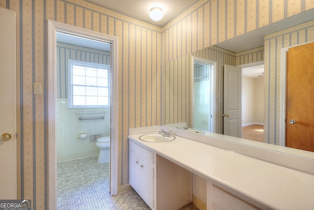 bathroom with vanity, tile patterned floors, and toilet