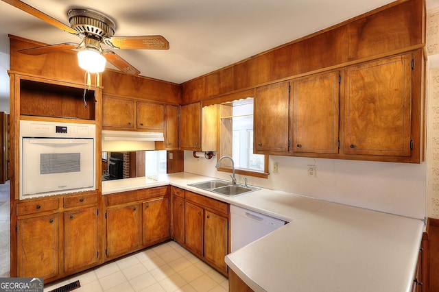 kitchen with ceiling fan, white appliances, and sink