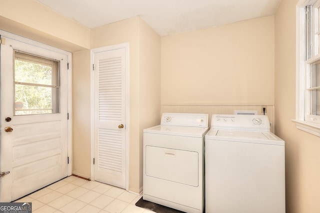 washroom with washing machine and dryer