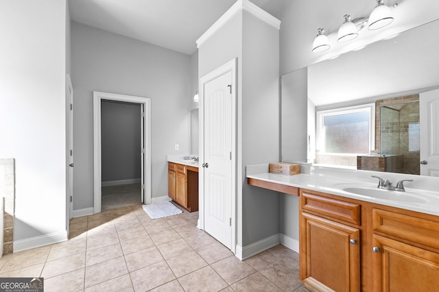 full bathroom featuring a shower stall, baseboards, tile patterned flooring, and vanity