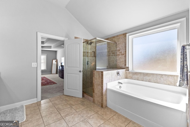 bathroom featuring lofted ceiling, tile patterned flooring, a shower stall, and a bath