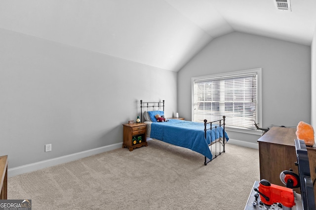 bedroom with lofted ceiling, baseboards, visible vents, and light colored carpet