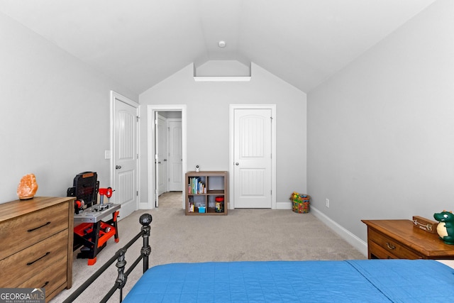 bedroom featuring carpet floors, baseboards, and lofted ceiling