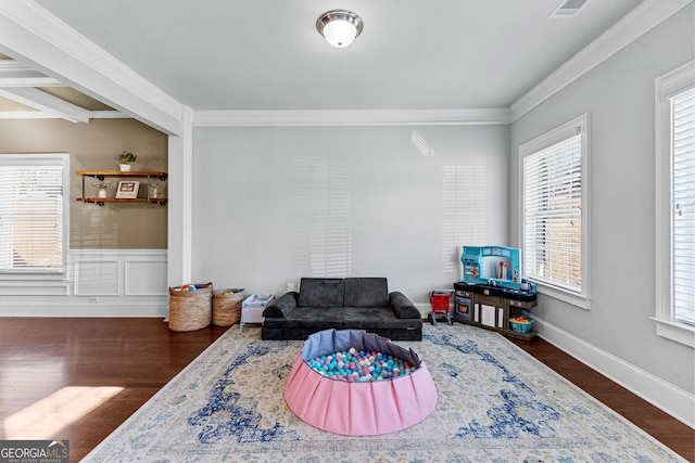 living area featuring ornamental molding, dark wood finished floors, visible vents, and baseboards