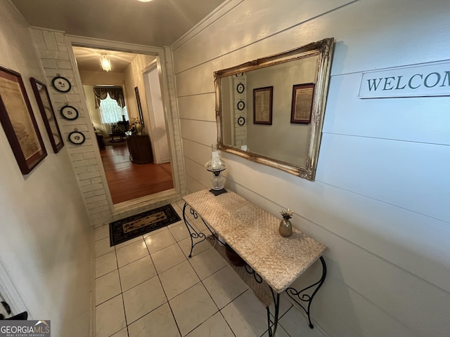 hall featuring light tile patterned floors