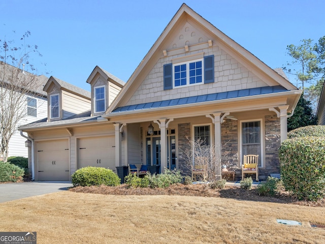 view of front facade featuring a garage and covered porch