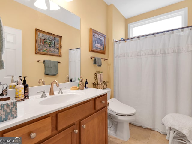 bathroom featuring tile patterned floors, toilet, and vanity