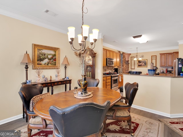 dining room with a notable chandelier, crown molding, and dark wood-type flooring