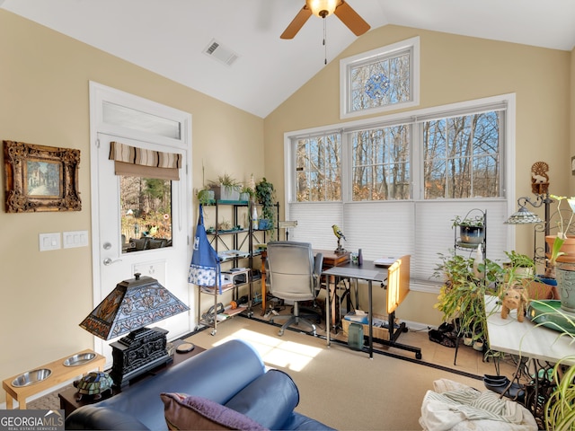 office space with ceiling fan, high vaulted ceiling, and light carpet