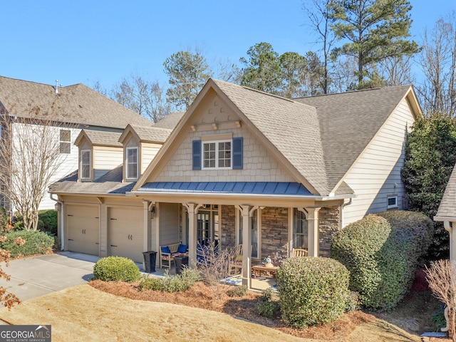 view of front of home with a garage and a porch