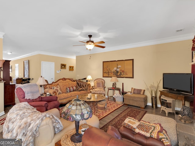 living room featuring crown molding, wood-type flooring, and ceiling fan