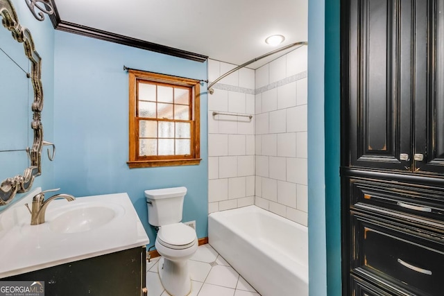 full bathroom featuring toilet, ornamental molding, vanity, tiled shower / bath combo, and tile patterned flooring